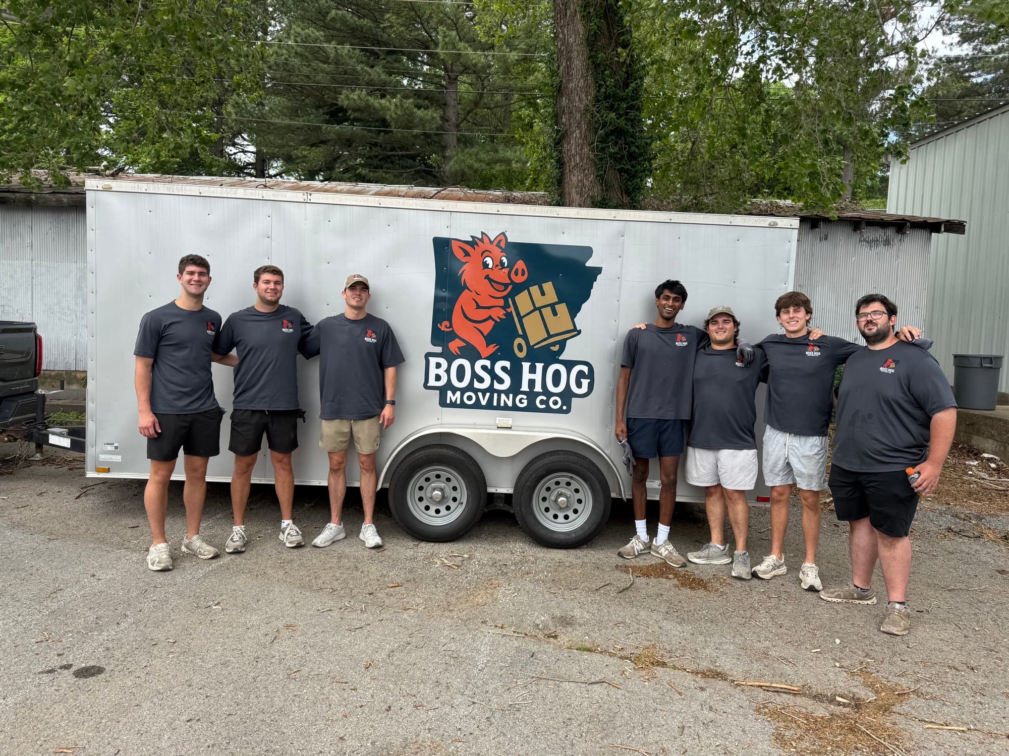 The Boss Hog Moving Co. crew in front of the company trailer